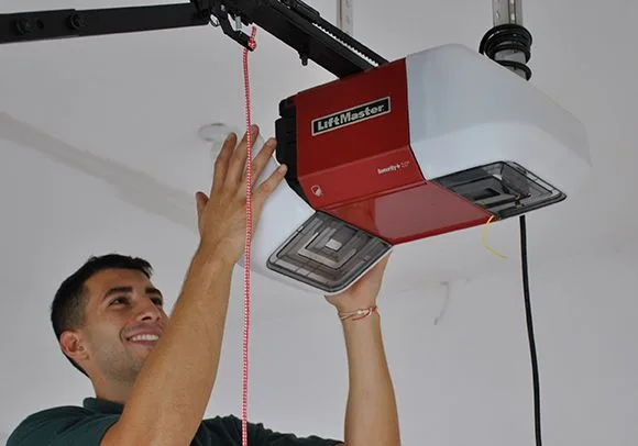 Technician looking at garage door opener