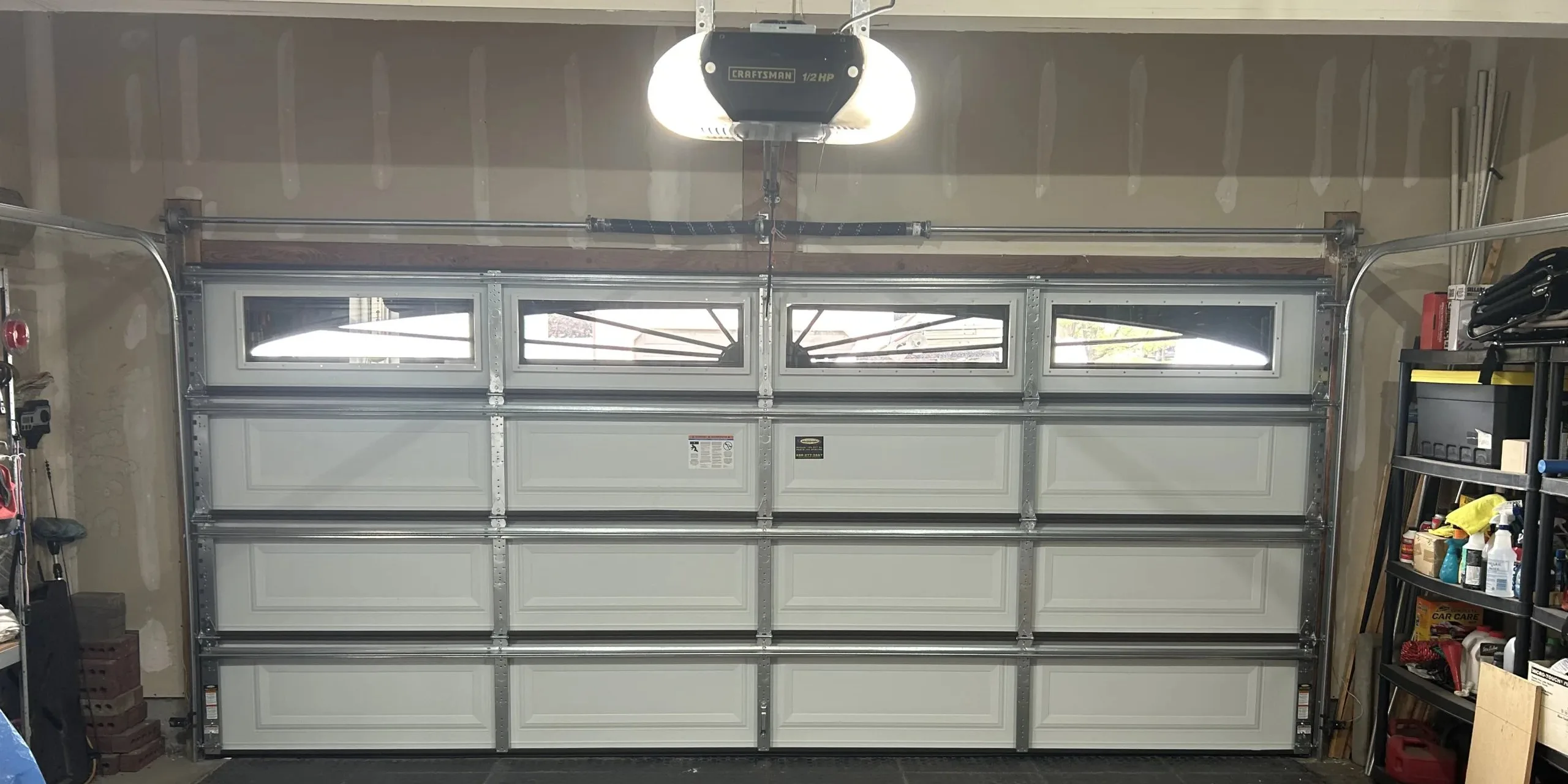 Best Garage Door Materials for Utah: Steel vs. Wood vs. Aluminum vs. Fiberglass (2026 Guide) Modern residential garage door showing quality materials and construction