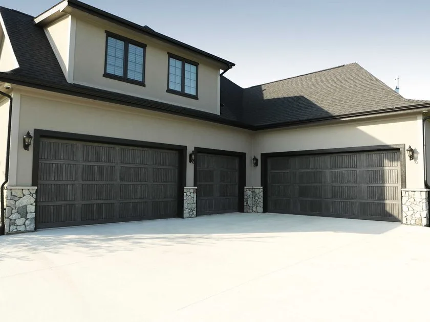 Garage Door Sizes: The Complete Guide for Utah Homeowners Three different sized garage doors on a home showing single and double car options
