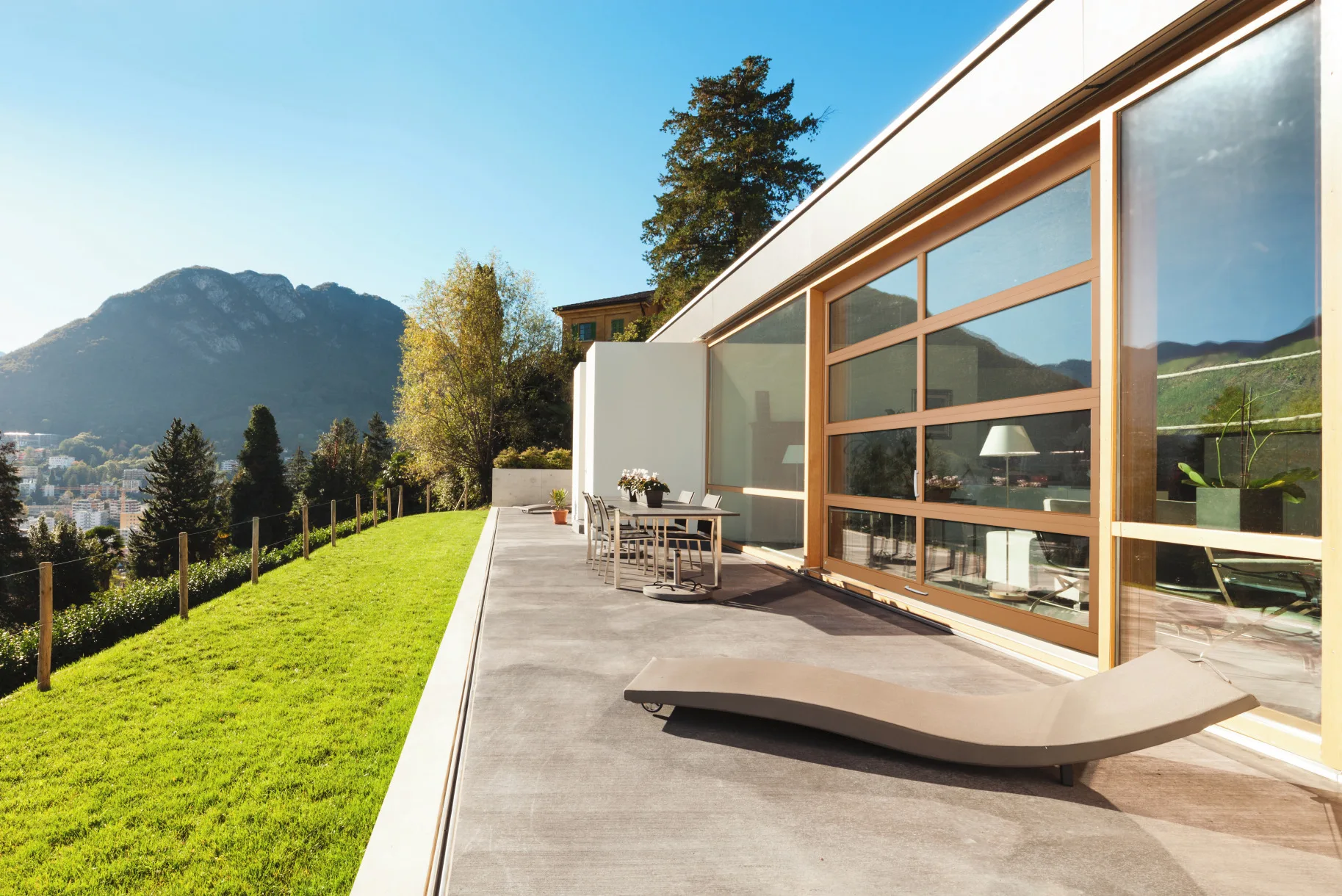 Glass Garage Doors: The Complete Guide for Utah Homeowners Full-view aluminum and glass garage door on modern home