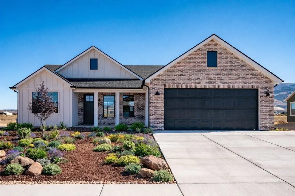 Garage Door Repair and Installation in Cedar City and Iron County, Utah Home with garage door in Iron County, Utah with desert landscape