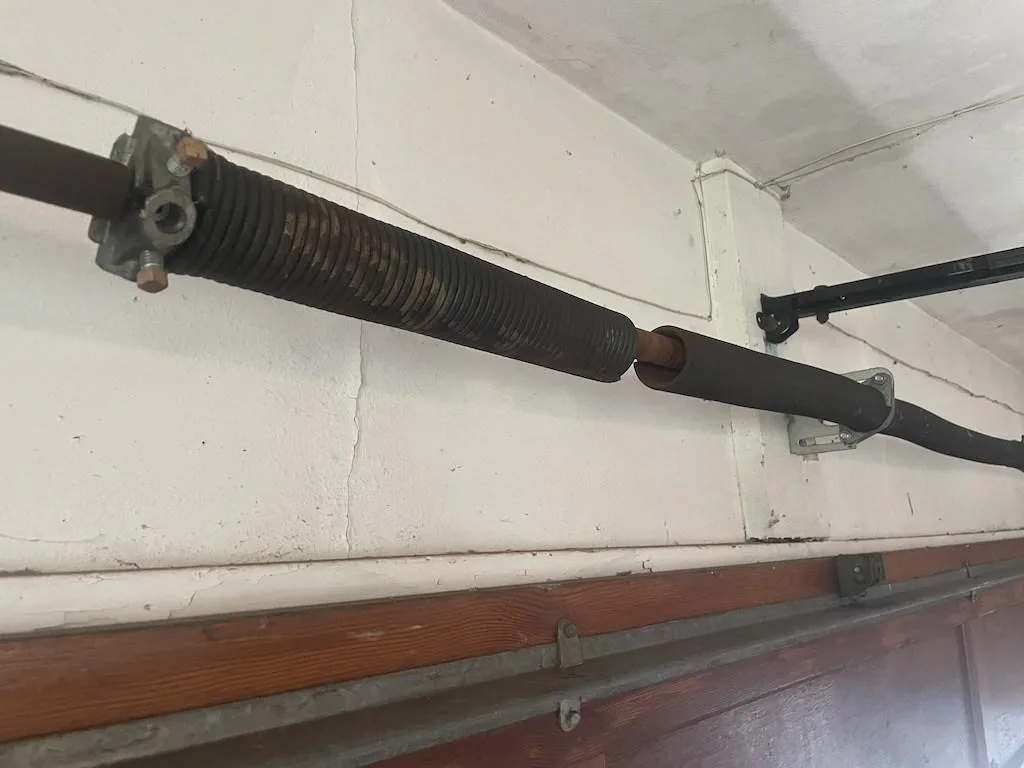 Common Warning Signs You Need Garage Door Spring Replacement worn_spring