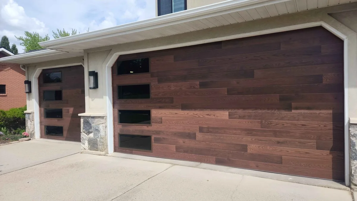 Aluminum Garage Doors: The Complete Guide for Utah Homeowners Modern aluminum and glass garage door on a contemporary Utah home