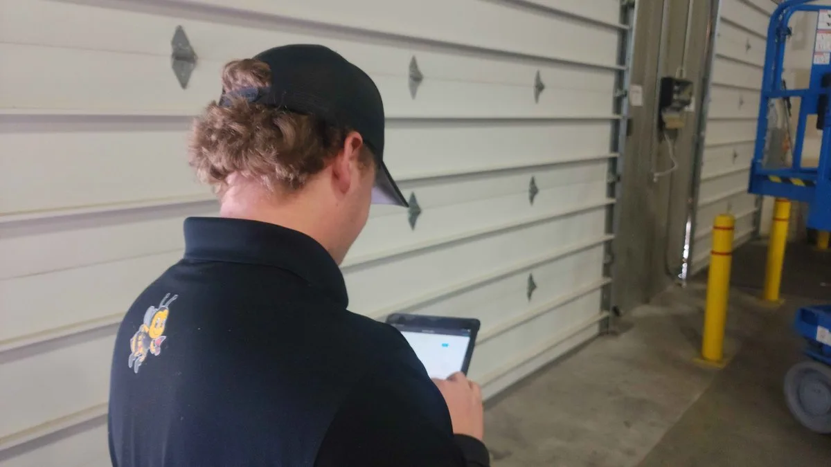 Garage Door and Home Inspections: What Utah Buyers, Sellers, and Homeowners Need to Know Home inspector examining a garage door during a property inspection