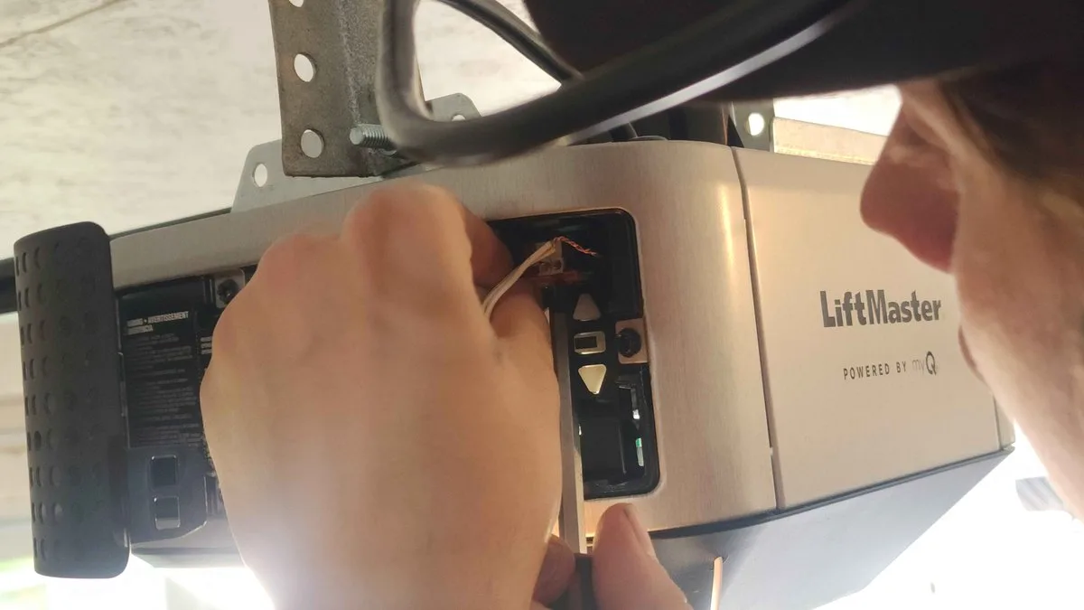 LiftMaster Garage Door Opener Troubleshooting: The Complete Guide for Utah Homeowners LiftMaster garage door opener motor unit mounted on ceiling